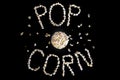 Popped Popcorn maize kernels and shaped in the word Ã¢â¬ËpopcornÃ¢â¬â¢